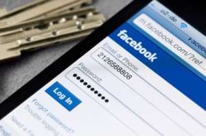 Facebook login screen on a smartphone and laptop